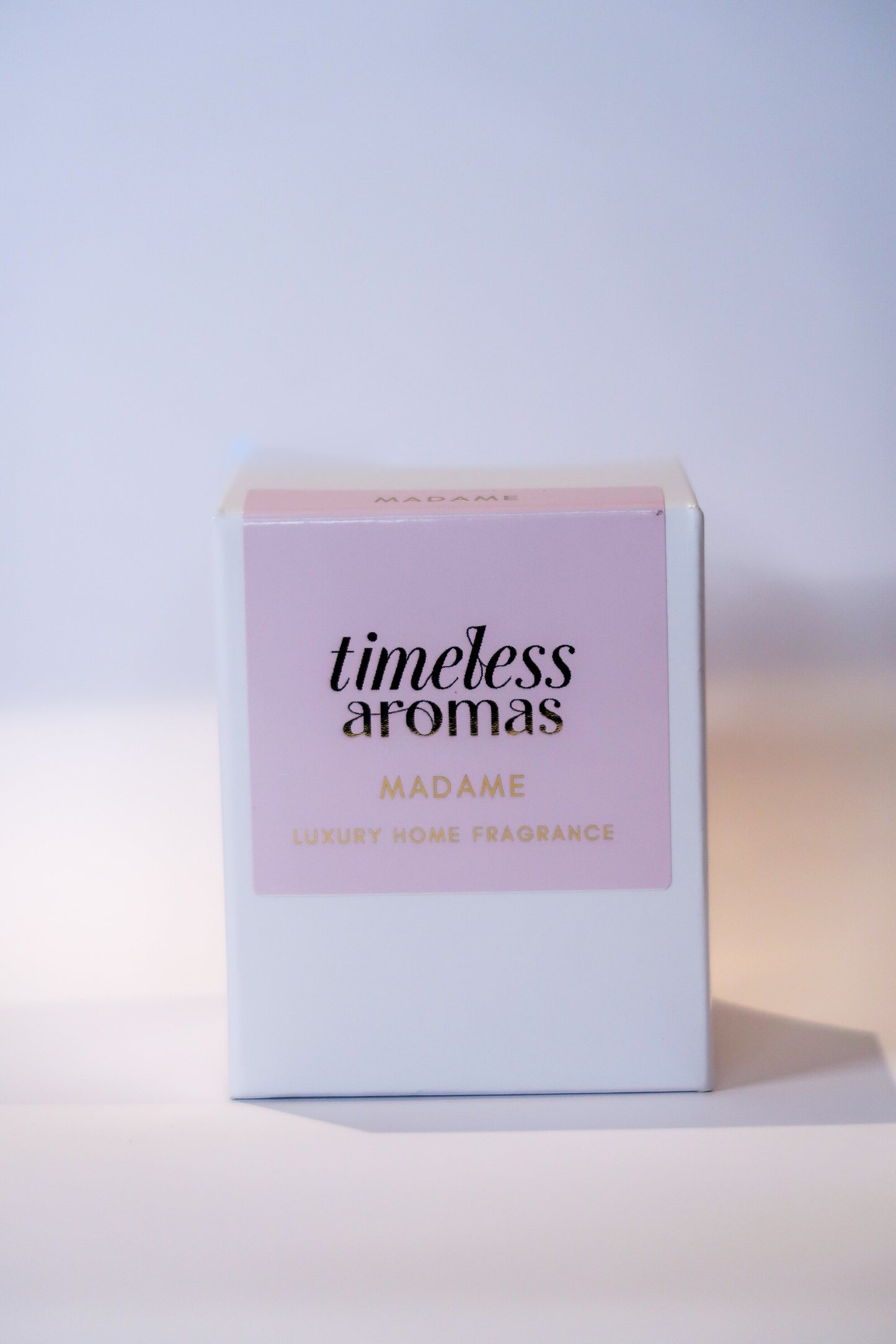 Packaging of the Madame Luxury Scented Candle from Timeless Aromas, featuring an elegant design. A beautiful addition to any home fragrance collection.