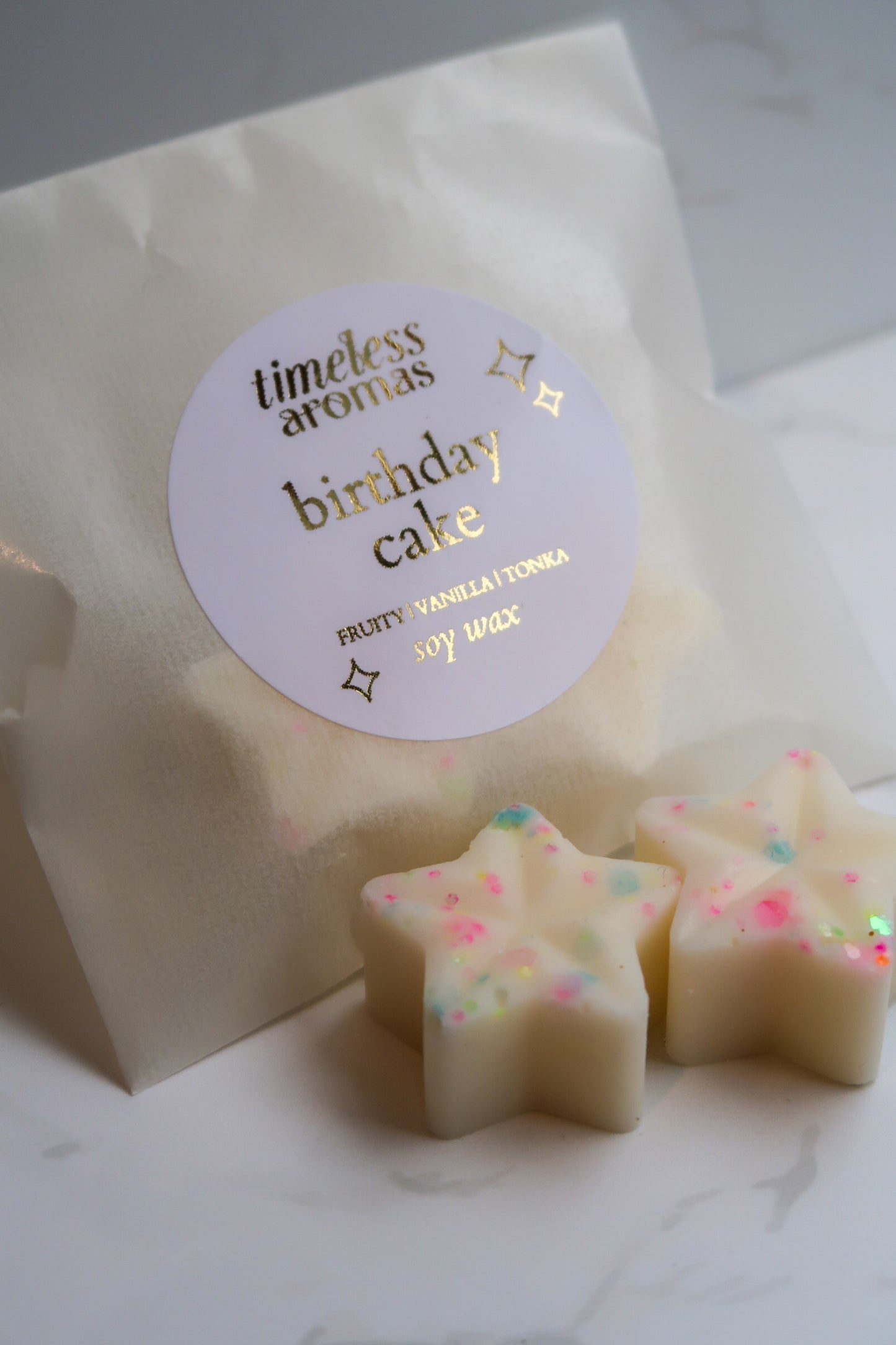 Timeless Aromas Ltd clearance highly scented wax melts - Birthday Cake, featuring star-shaped creamy wax melts in a decorative pack with a stylish label.
