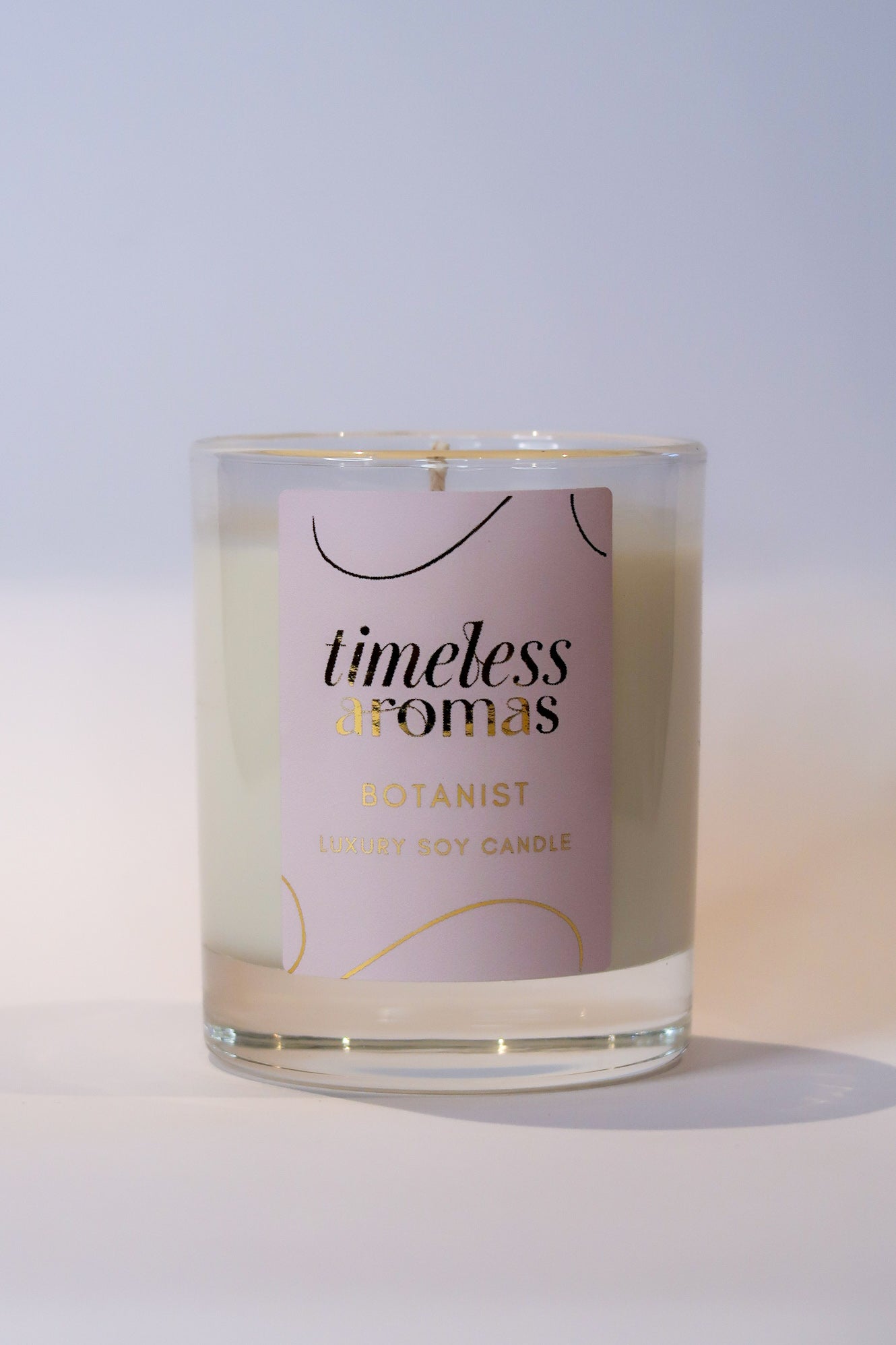 Timeless Aromas Botanist Handcrafted Luxury Candle displayed in front view, highlighting its luxurious design, ideal for home fragrance lovers.