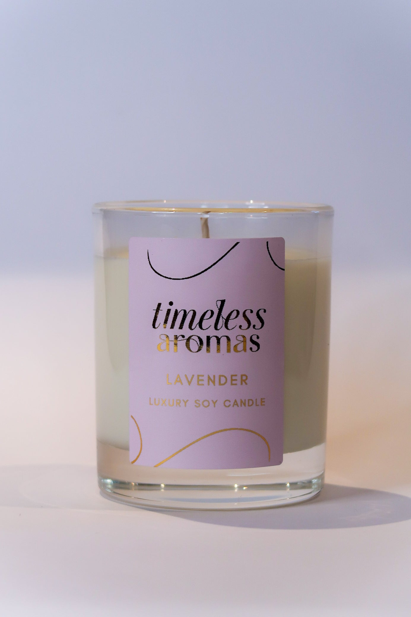 Close-up of the Lavender Luxury Scented Candle from Timeless Aromas, highlighting the elegant design and soothing soft wax.