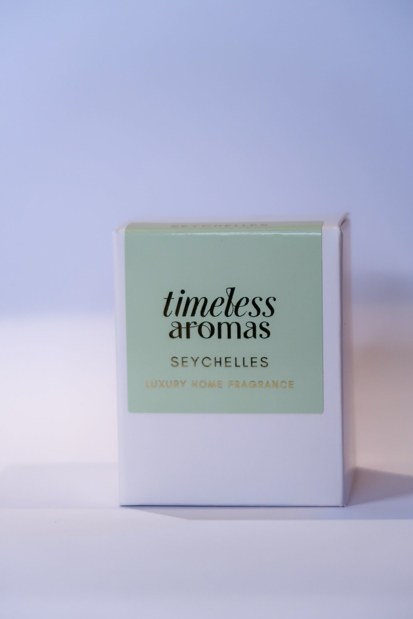 Stylish packaging of the Seychelles Luxury Scented Candle by Timeless Aromas, featuring a sophisticated green design, symbolising tropical luxury and exotic fragrances.