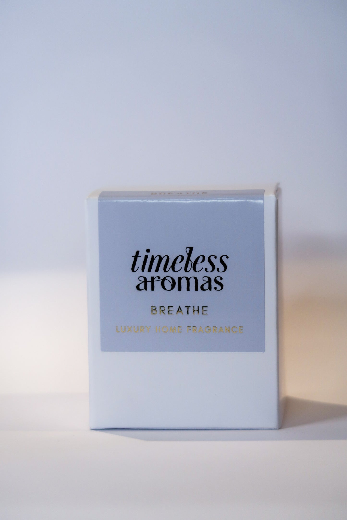 Breathe luxury scented candle by Timeless Aromas displayed in its stylish box, perfect for gifting or enhancing your home with a vibrant citrus and floral fragrance.