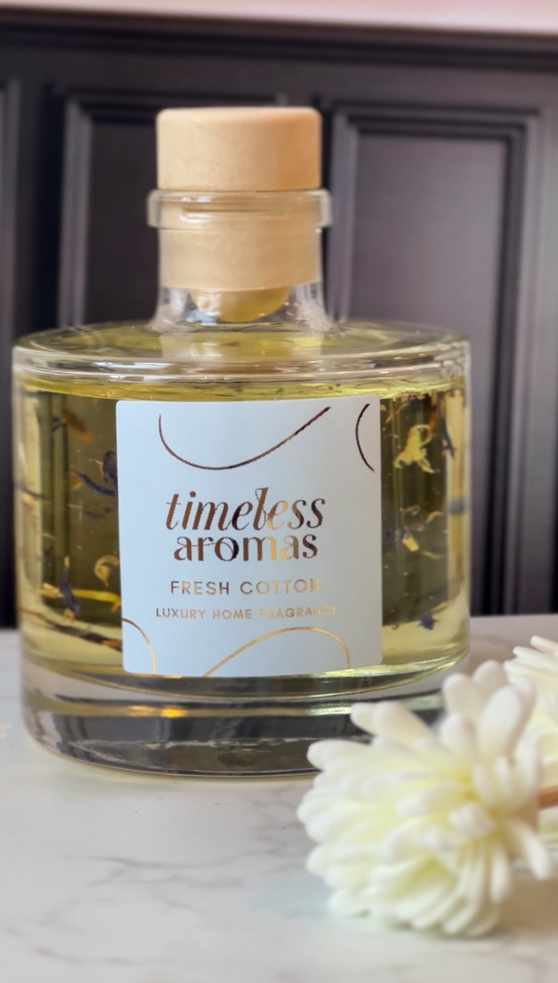 Fresh Cotton Luxury Reed Diffuser by Timeless Aromas Ltd, showcasing a beautifully designed glass bottle filled with fragrant oils, perfect for creating a fresh and clean atmosphere in your home.