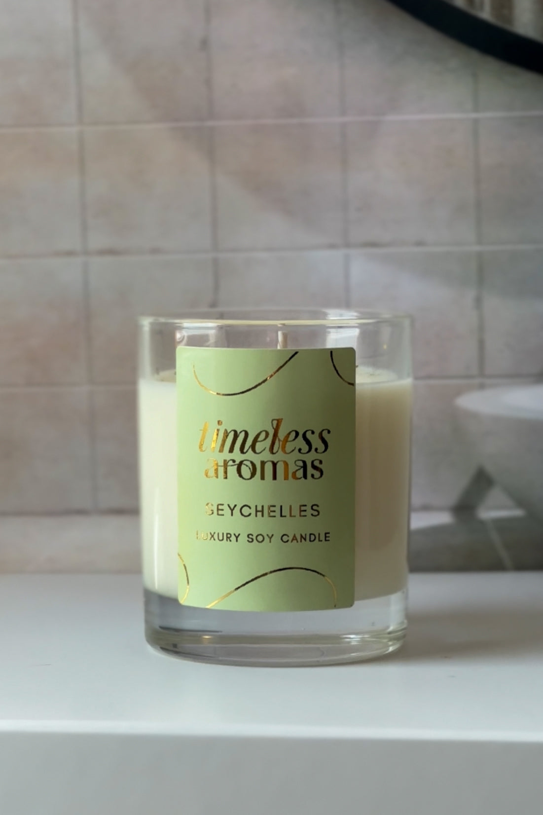 Seychelles Luxury Soy Candle by Timeless Aromas positioned gracefully with a subtle background, capturing the essence of relaxation, a true seychelles luxury scented candle experience.
