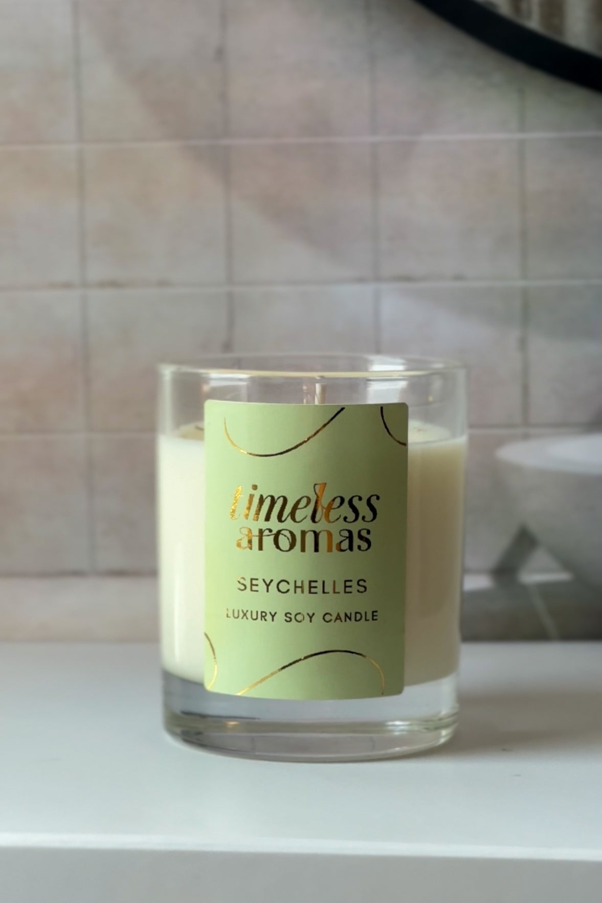 Stylish display of the Seychelles Luxury Soy Candle by Timeless Aromas, exuding elegance and tranquility, embodying the nature of a seychelles luxury scented candle for a serene ambiance.