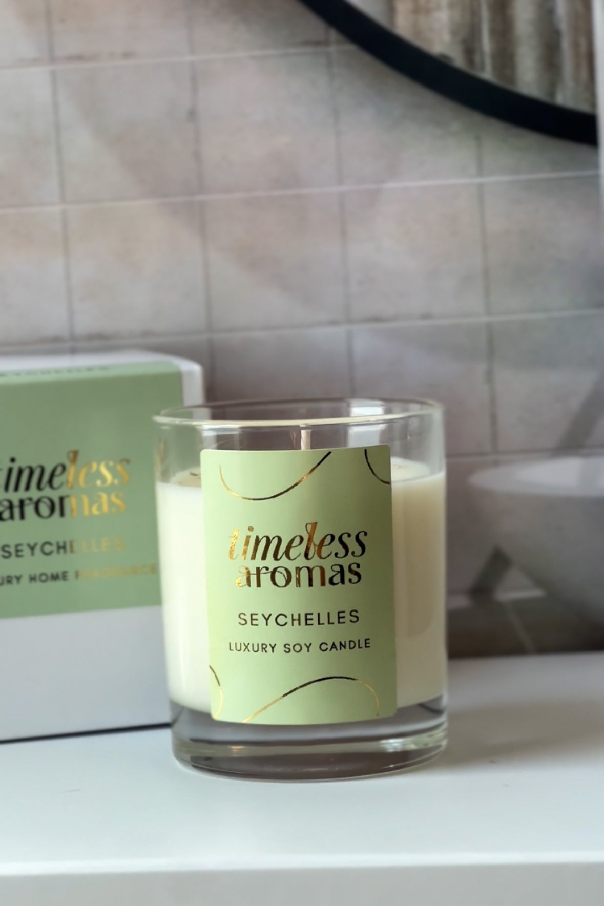 Seychelles Luxury Soy Candle by Timeless Aromas in a refined setting, showcasing its chic design and luxurious scent, ideal for those seeking a premium seychelles luxury scented candle.
