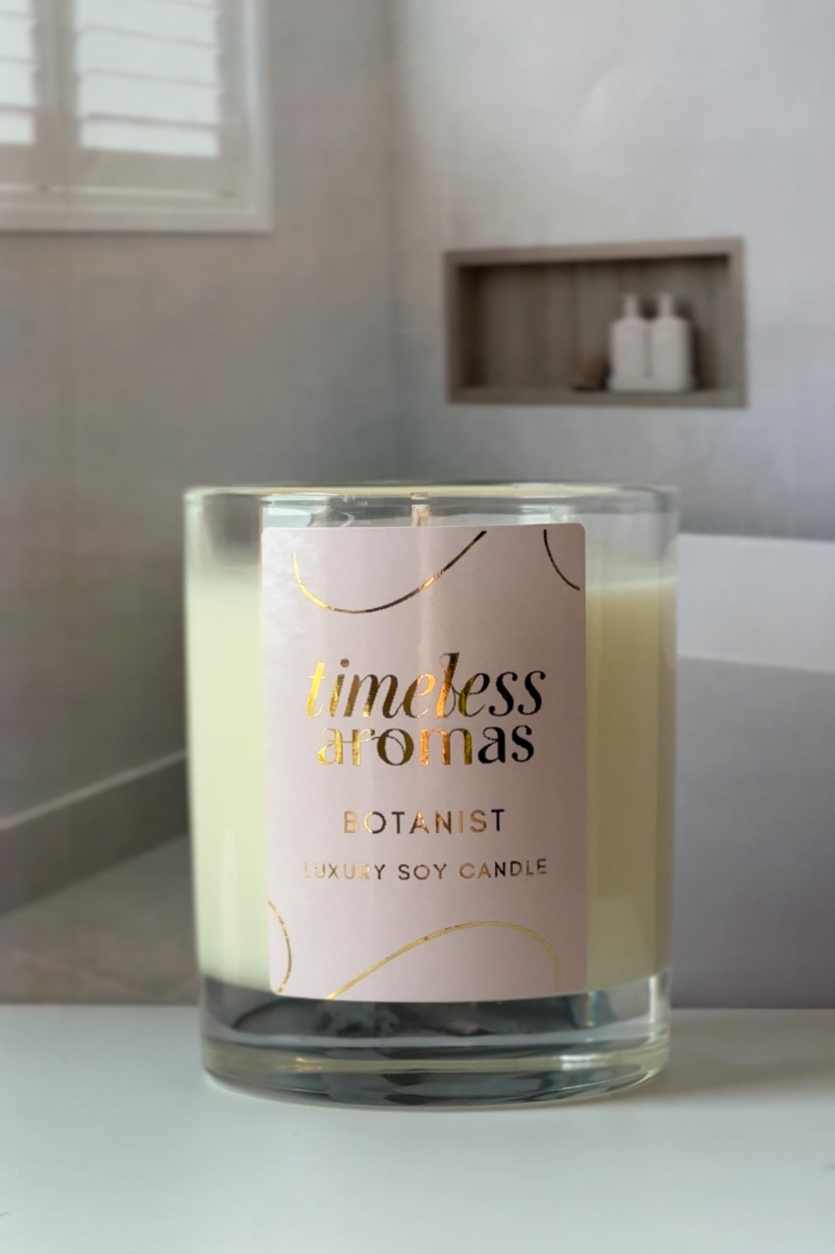 Timeless Aromas Botanist Luxury Candle featuring elegant packaging, showcasing a handcrafted luxury candle with a floral design, perfect for creating an energizing atmosphere.