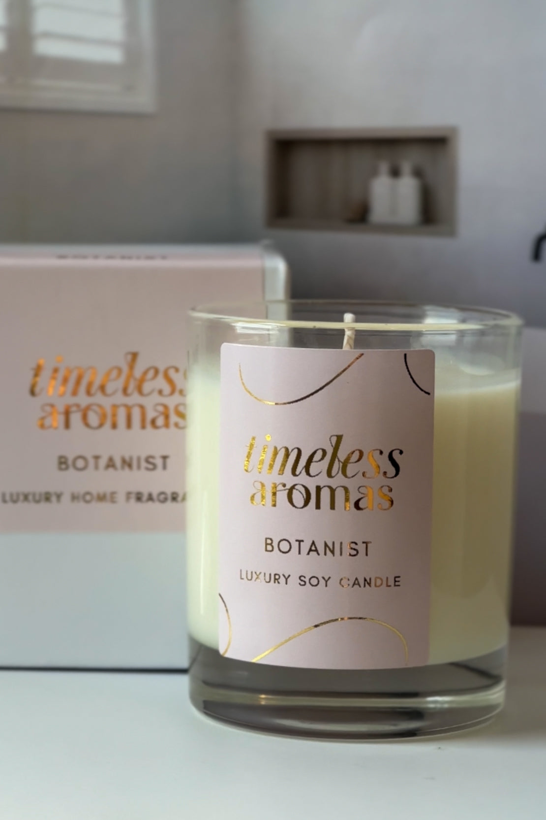 A stunning view of Timeless Aromas Botanist Luxury Candle, highlighting its handcrafted luxury candle qualities, adorned with floral elements for a refreshing vibe.