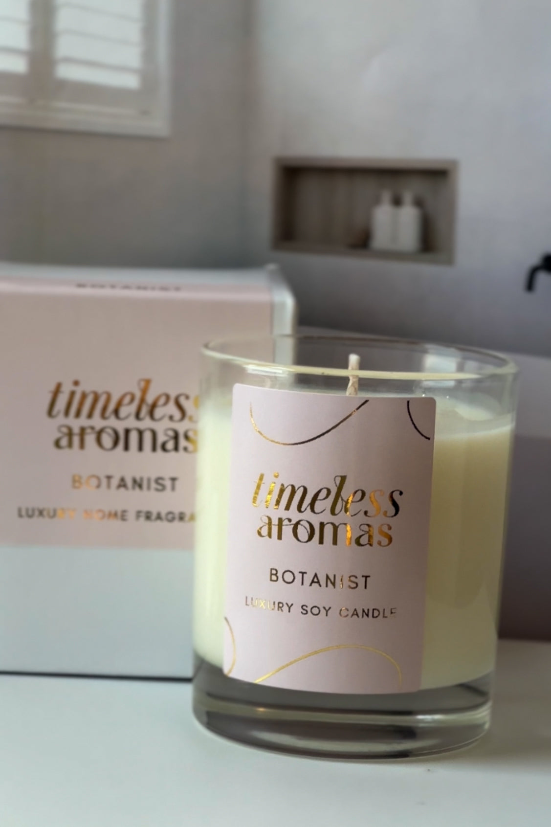 Timeless Aromas Botanist Luxury Candle displayed against a serene backdrop, emphasizing its handcrafted luxury candle appeal and floral notes that invigorate the home.
