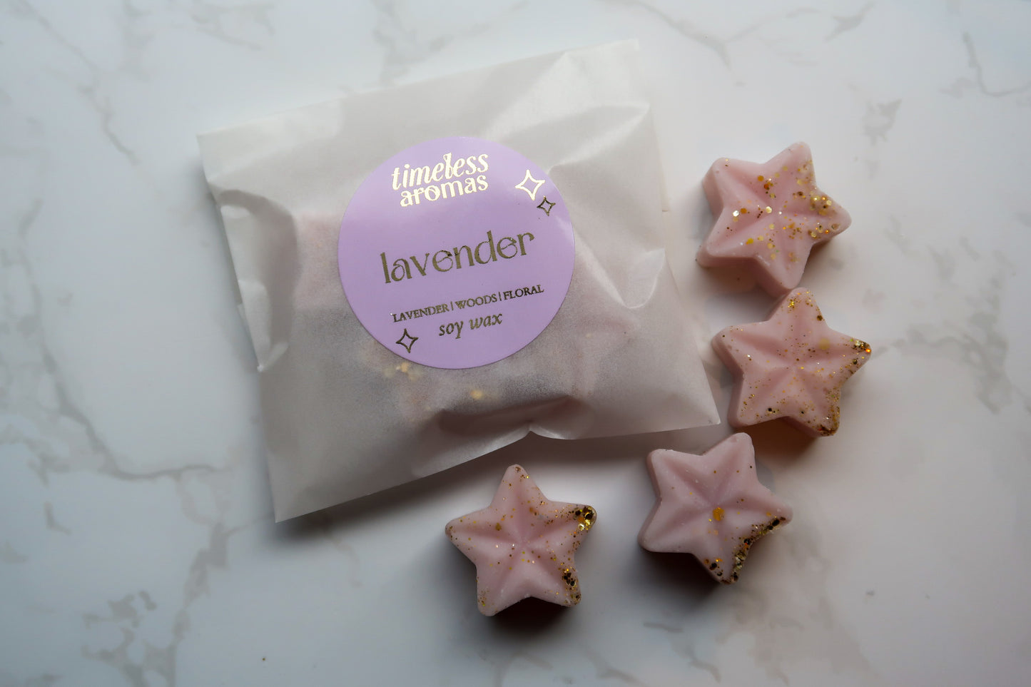 Close-up of Timeless Aromas Lilac Wax Melt Gift Set with Lavender wax melt, beautifully shaped as a star and adorned with a stylish label.