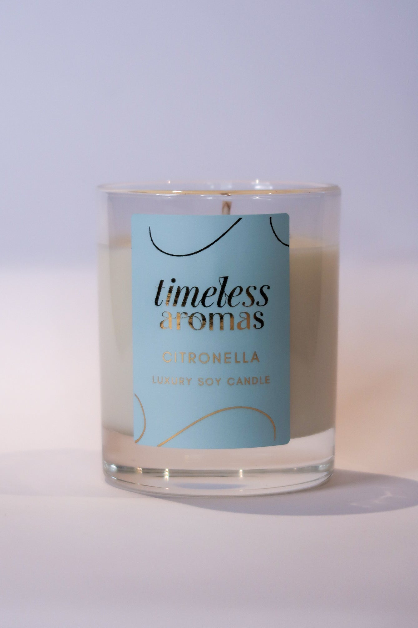 Timeless Aromas citronella luxury candle, featuring a luxurious design and fresh fragrance, ideal for creating a bug-free ambiance.