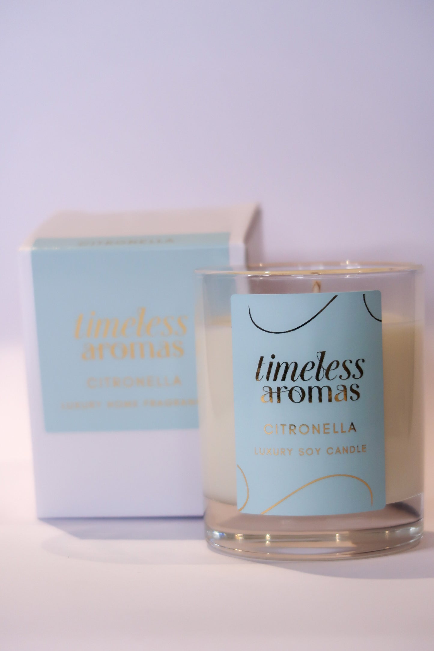 Beautifully packaged citronella luxury candle from Timeless Aromas, designed to provide a refreshing aroma while repelling insects.