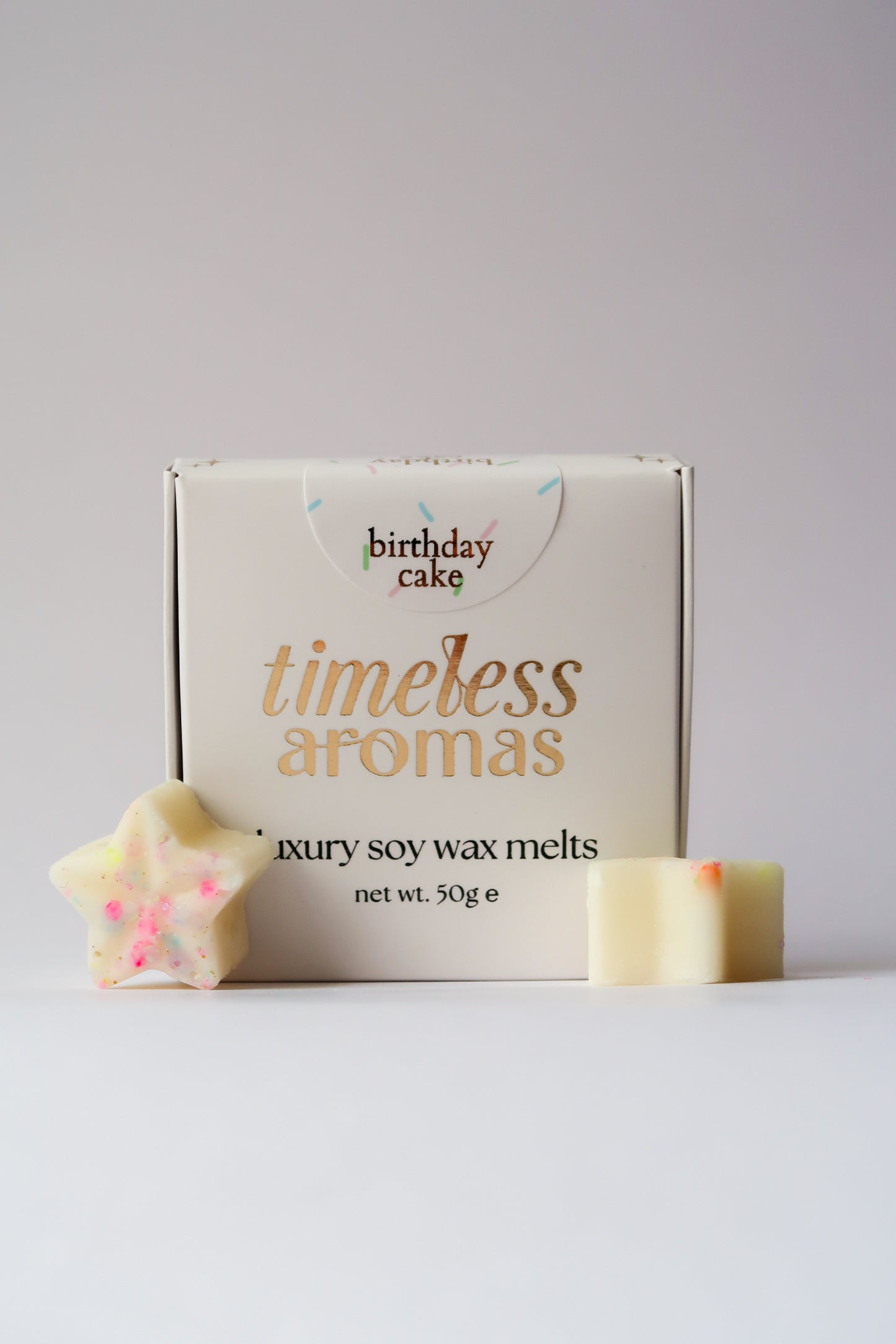 Timeless Aromas Birthday Cake Wax Melt Box featuring luxury soy wax melts shaped like stars, perfect for adding a sweet birthday cake scent to your home.