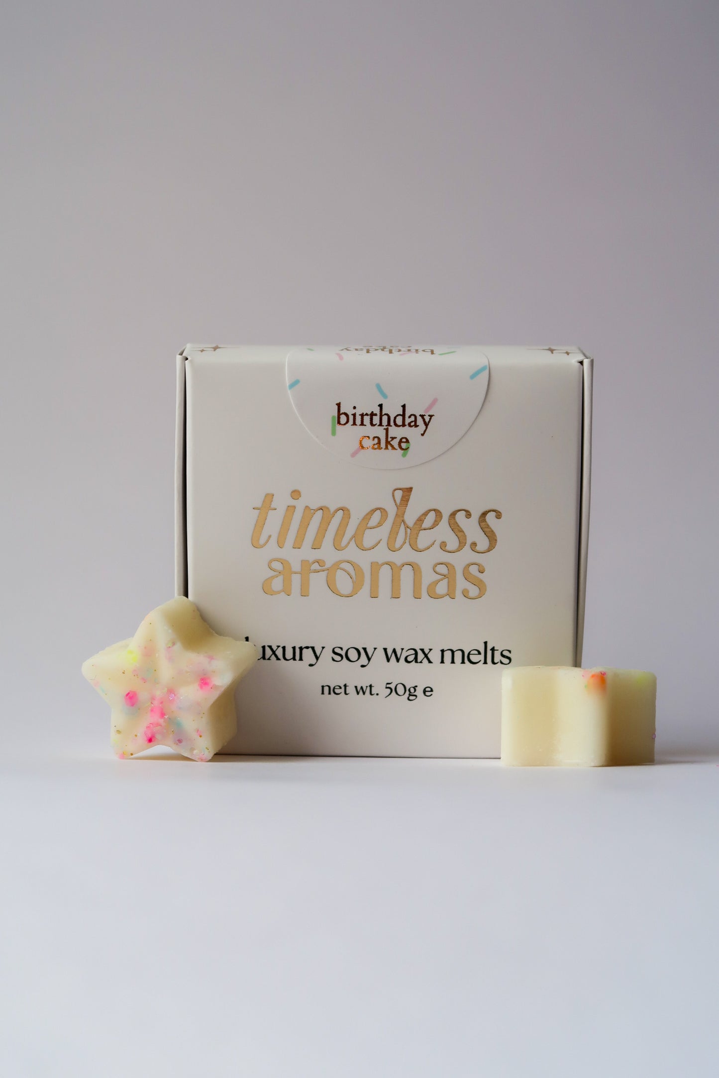 Timeless Aromas Birthday Cake Wax Melt Box featuring luxury soy wax melts shaped like stars, perfect for adding a sweet birthday cake scent to your home.