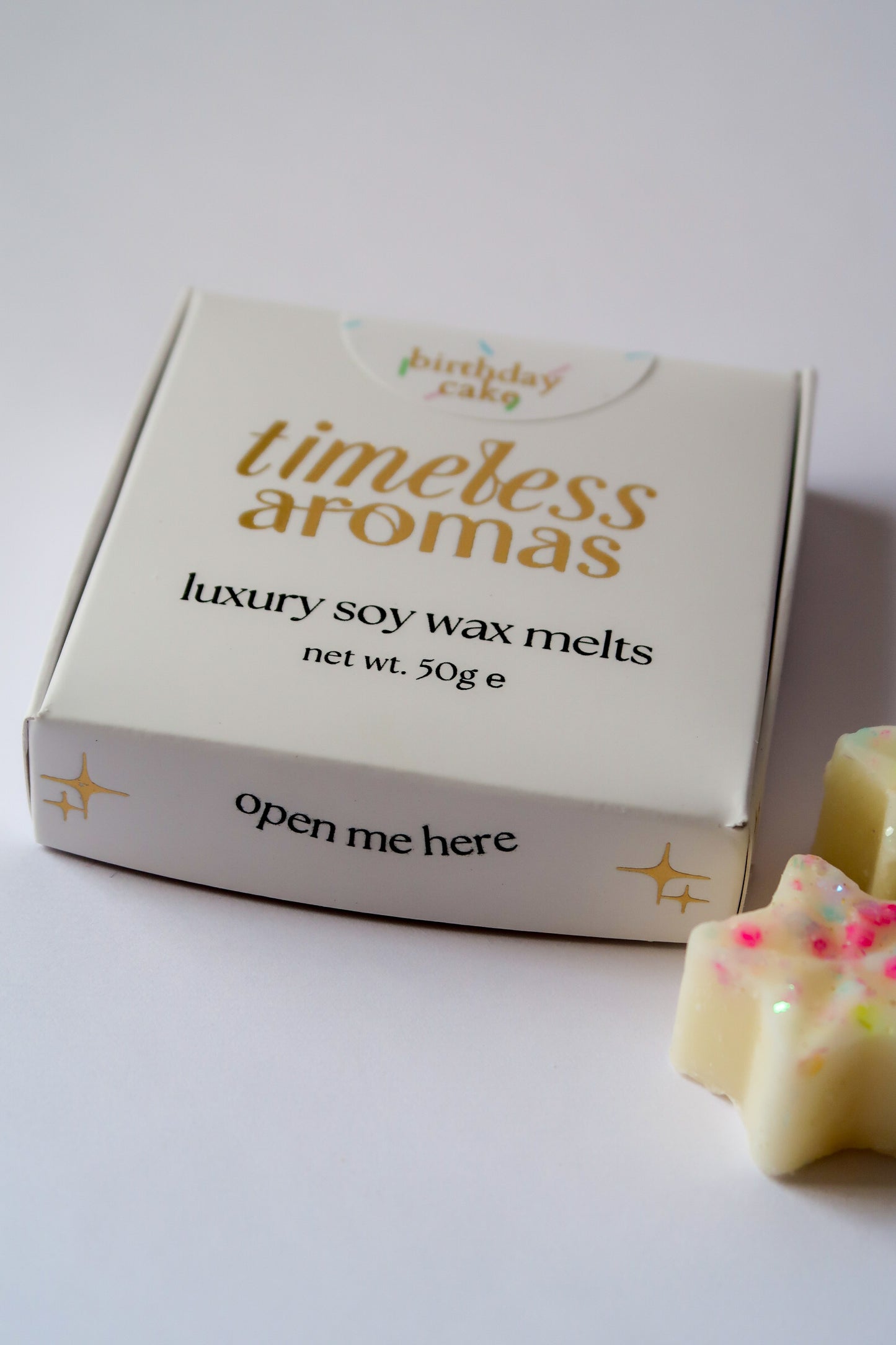 Timeless Aromas Birthday Cake Wax Melt Box featuring luxury soy wax melts shaped like stars, perfect for adding a sweet birthday cake scent to your home.