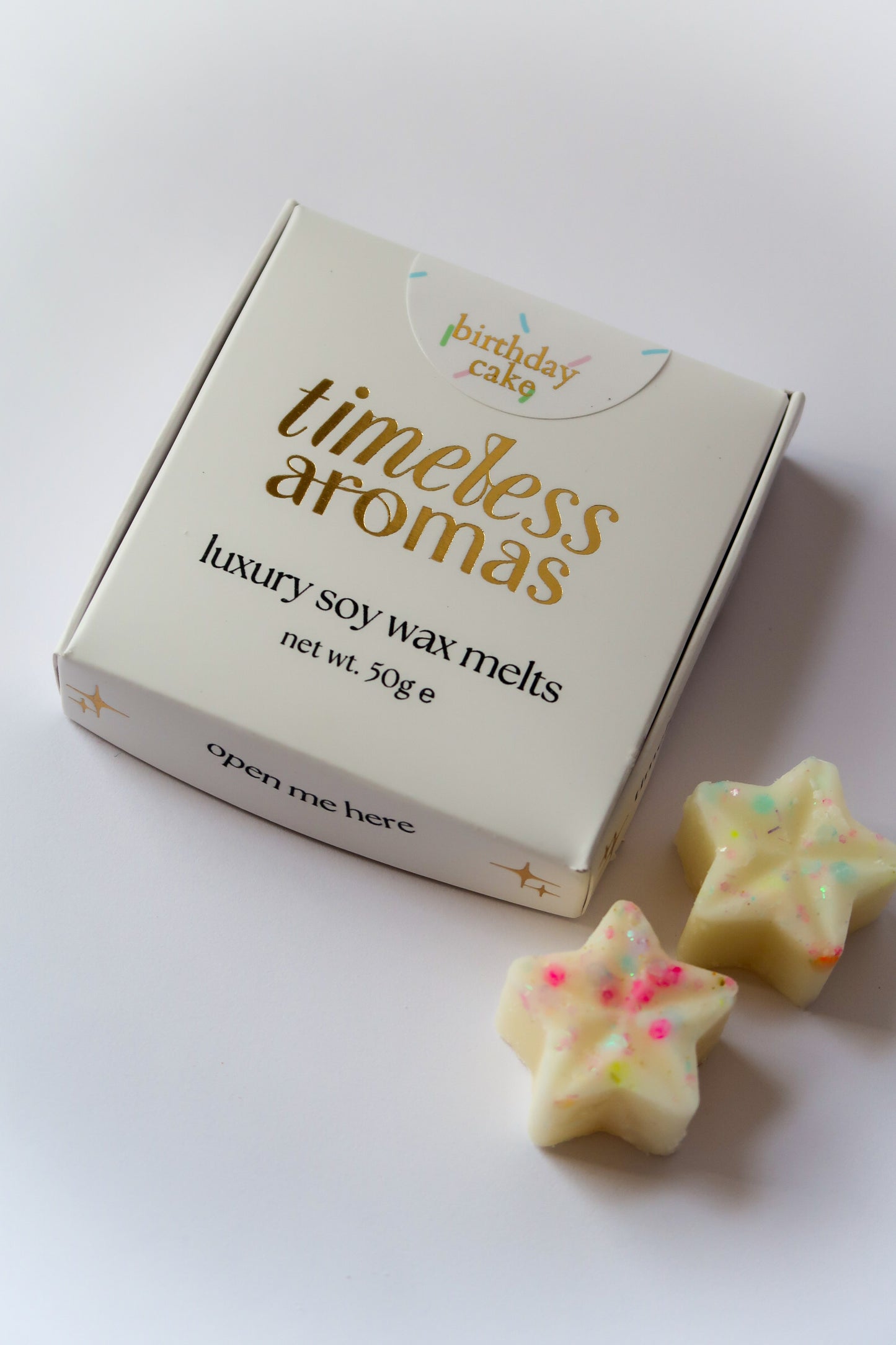 Timeless Aromas Birthday Cake Wax Melt Box featuring luxury soy wax melts shaped like stars, perfect for adding a sweet birthday cake scent to your home.