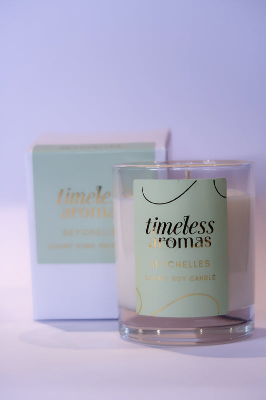 Seychelles Luxury Scented Candle by Timeless Aromas, elegantly presented in a glass container with a refreshing citrus coconut fragrance, ideal for creating a luxurious atmosphere.