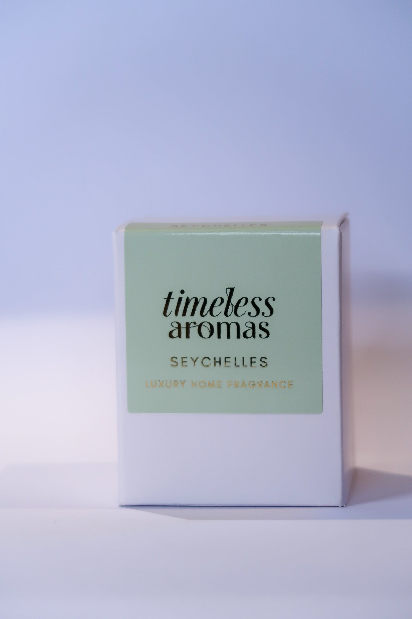 Stylish packaging of the Seychelles Luxury Scented Candle by Timeless Aromas, featuring a sophisticated green design, symbolising tropical luxury and exotic fragrances.