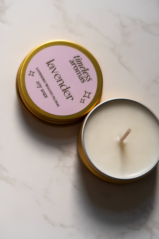 Lavender Mini Gold Tin Candle by Timeless Aromas, featuring a removable lid revealing the calming white soy wax interior, ideal for a soothing atmosphere.