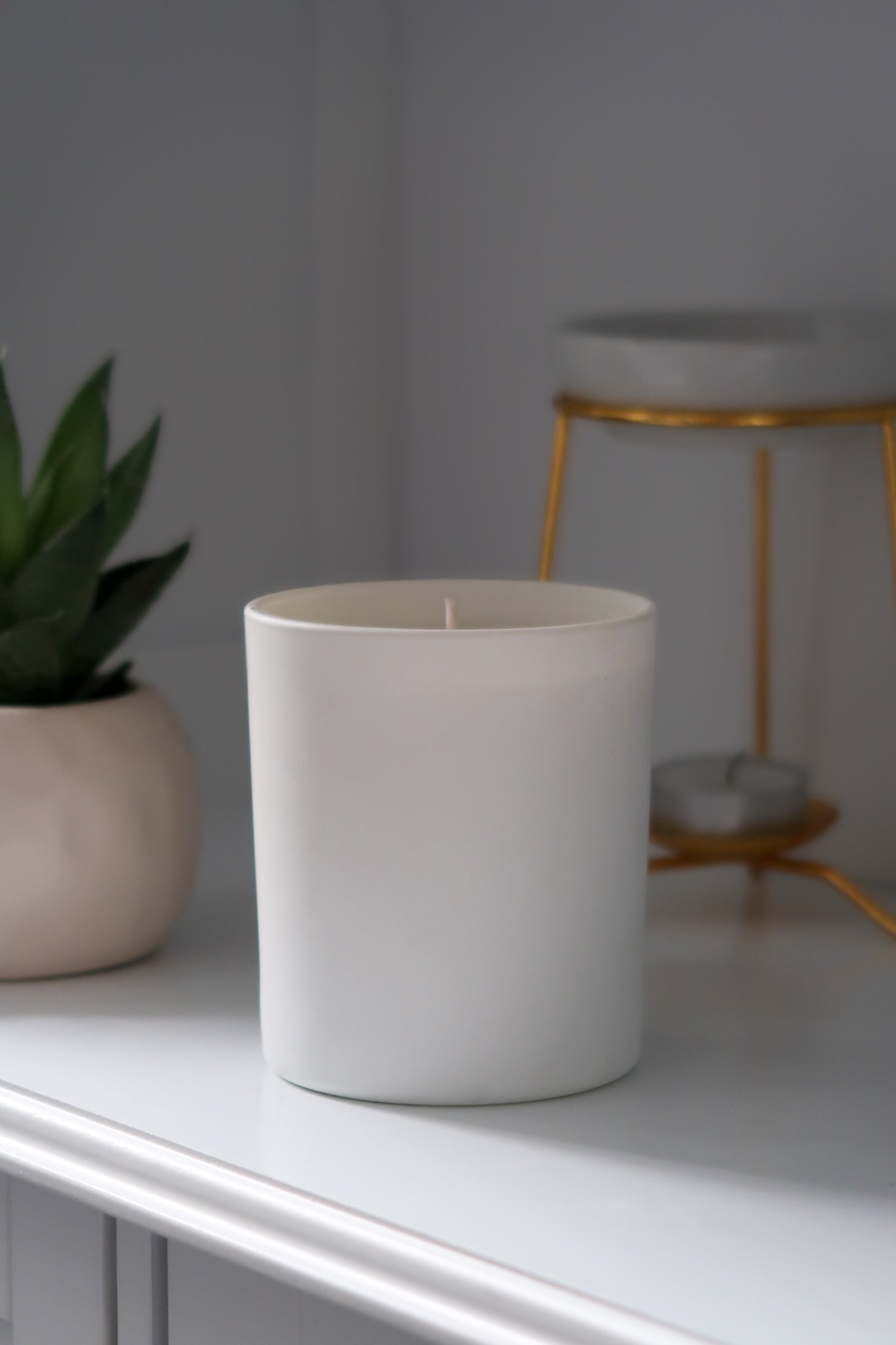 An unlit 30cl White Matte Candle from Timeless Aromas Ltd, part of a stylish pack of 6 hand poured candles made for gifting or enhancing home fragrance. This matte ceramic jar candle is perfect for clean, elegant decor. Blank label candles for businesses 