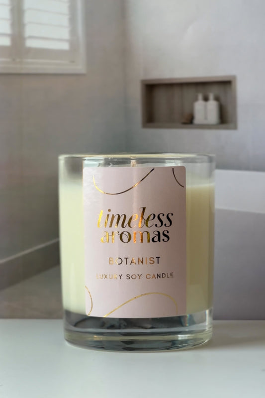 Timeless Aromas Botanist Luxury Candle featuring elegant packaging, showcasing a handcrafted luxury candle with a floral design, perfect for creating an energizing atmosphere.