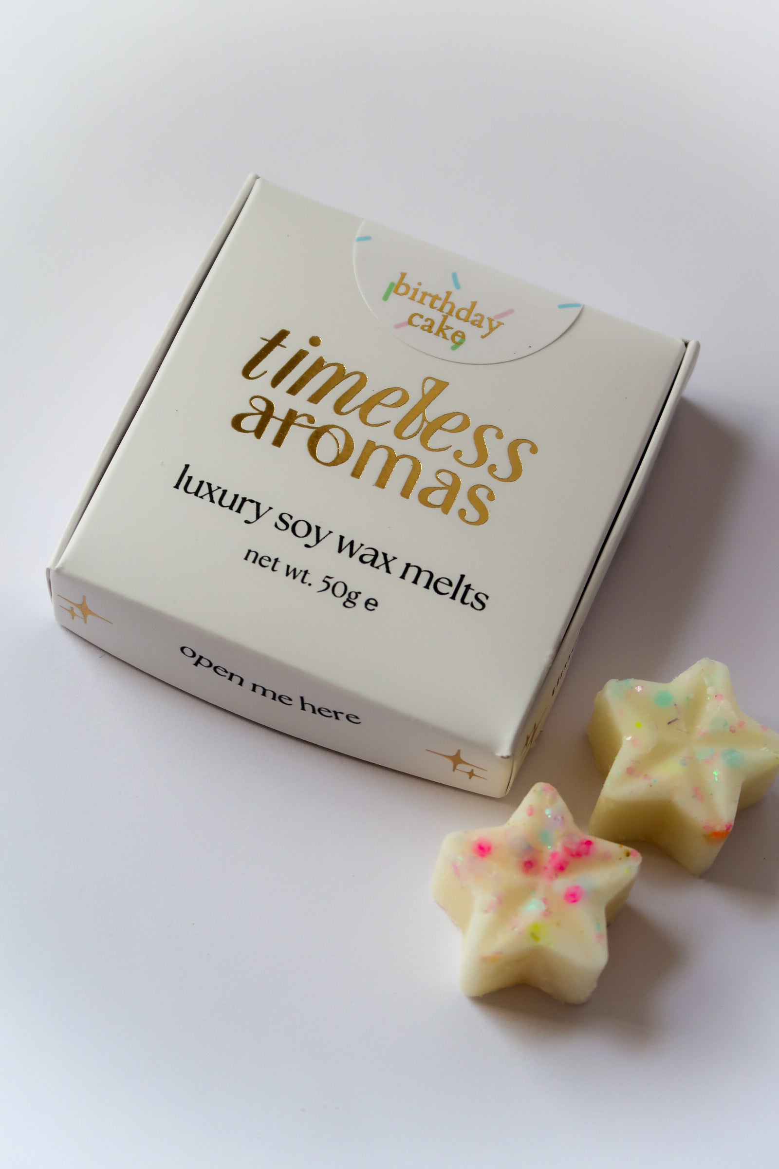 Timeless Aromas Birthday Cake Wax Melt Box featuring luxury soy wax melts shaped like stars, perfect for adding a sweet birthday cake scent to your home.