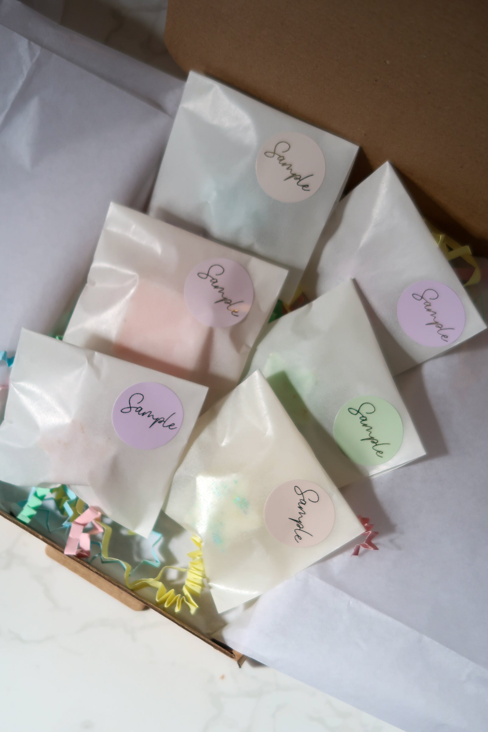 An enticing view of the Discovery Melt Box from Timeless Aromas Ltd, displaying sample wax melts packaged elegantly with labels, perfect for discovering new fragrances at home.