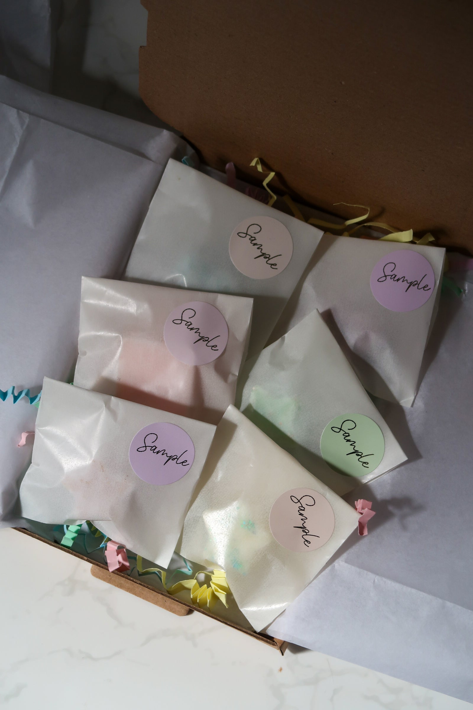 The Discovery Melt Box by Timeless Aromas Ltd, featuring an assortment of colourful wax melts in decorative packaging, offering a delightful sensory exploration of fragrances.