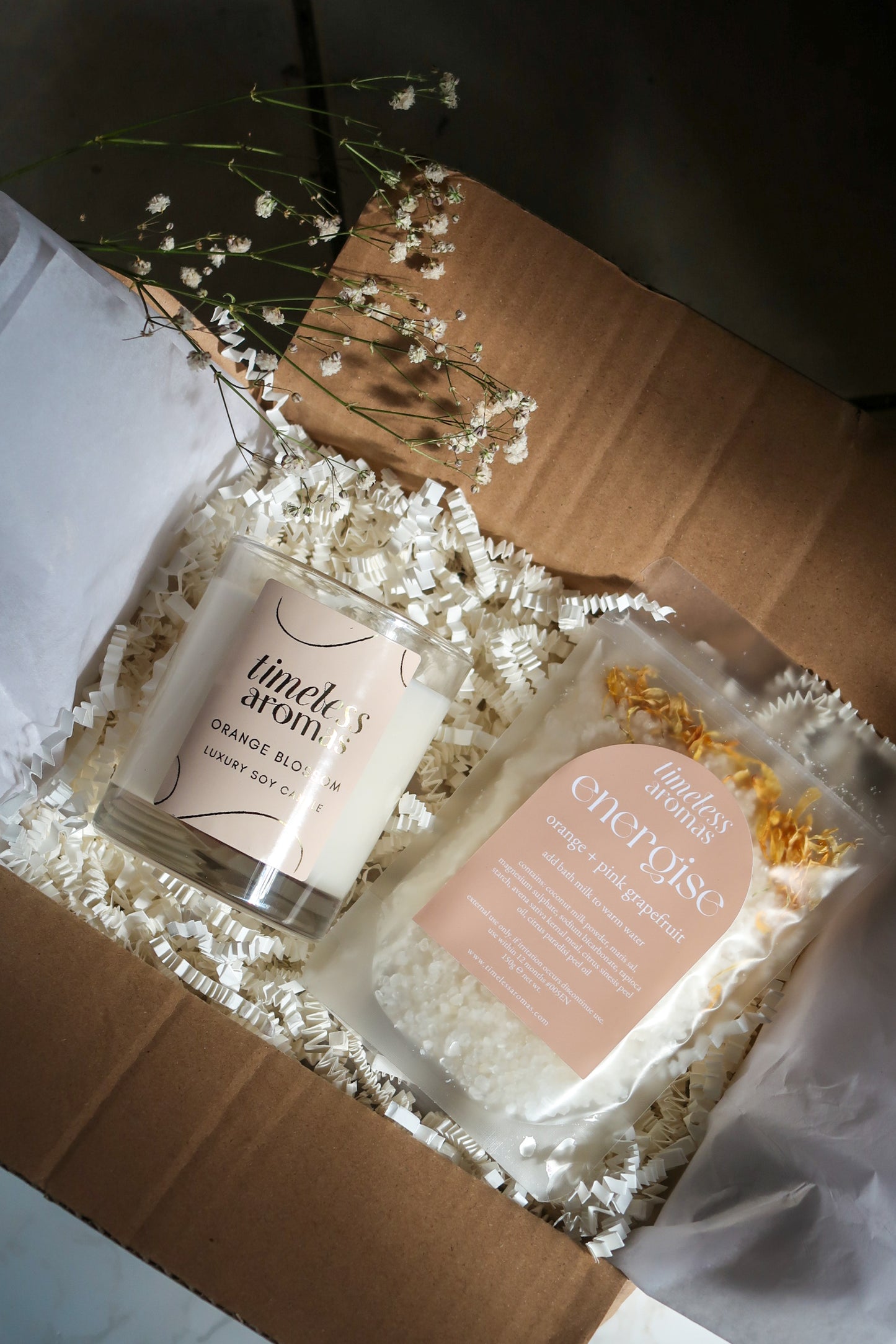 Timeless Aromas Bloom and Energise Gift Set displayed in packaging, includes a 200g orange blossom candle and bath milk, perfect for a floral home fragrance set with uplifting orange vibes.